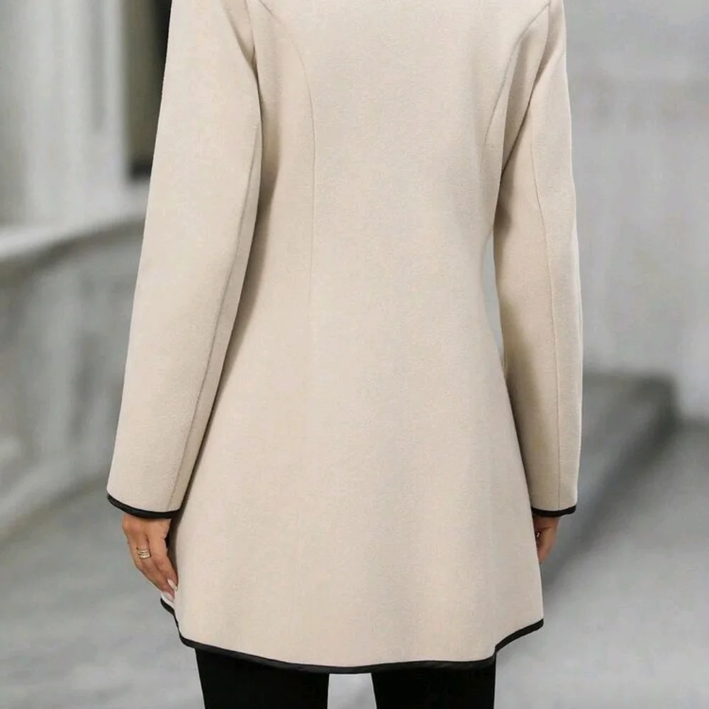 Chic Cream Trench Coat with Black Accents - Picture 2 of 3